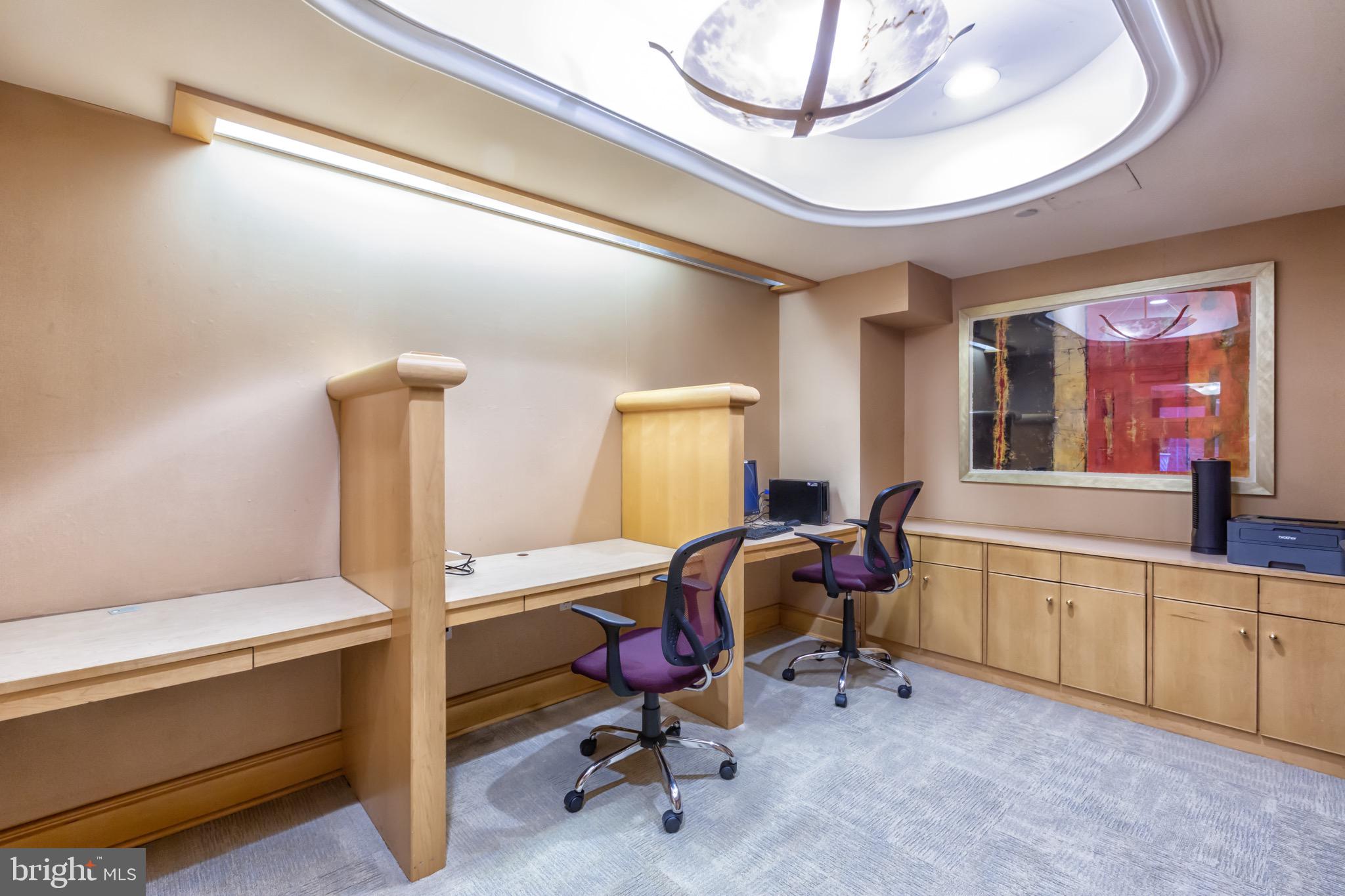 616 E Street Northwest, Unit 1152 Washington, DC 20004 - Photo 59 of 92 a view of a workspace with furniture and a window