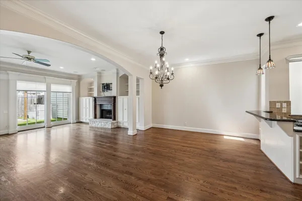 a view of a room with wooden floor