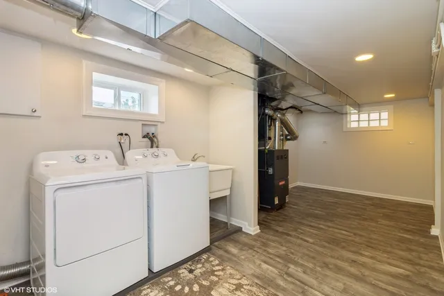 a view of storage and utility room with washer and dryer