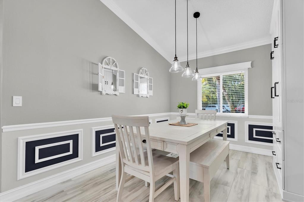 1170 Falcon Ridge Lane Palm Harbor, FL 34683 - Photo 13 of 35 a view of a dining room with furniture window and wooden floor