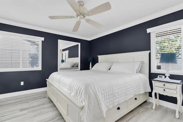 a bedroom with a large bed and a window