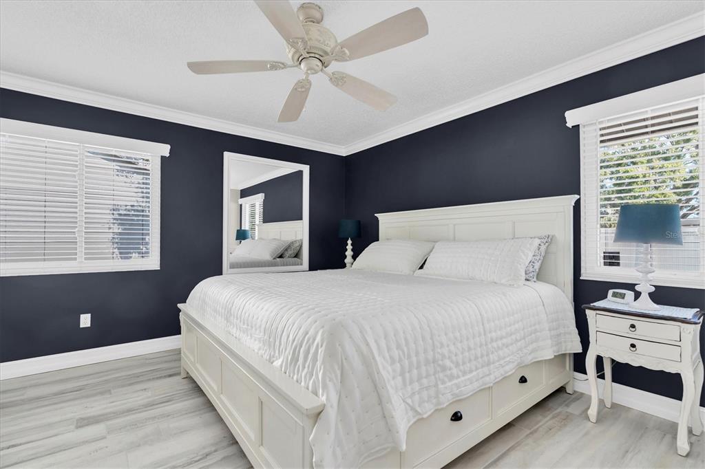 1170 Falcon Ridge Lane Palm Harbor, FL 34683 - Photo 15 of 35 a bedroom with a large bed and a window