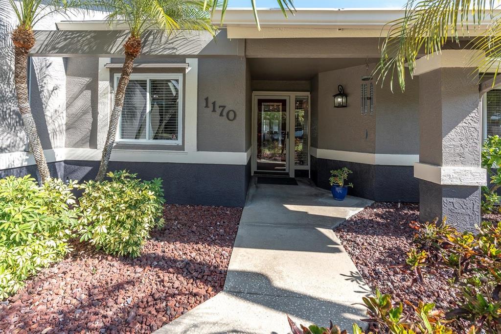 1170 Falcon Ridge Lane Palm Harbor, FL 34683 - Photo 2 of 35 a front view of a house