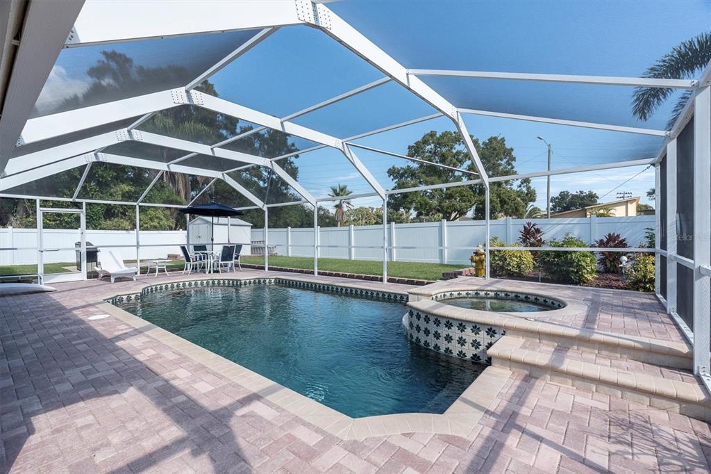 1170 Falcon Ridge Lane Palm Harbor, FL 34683 - Photo 27 of 35 a view of a swimming pool with a patio