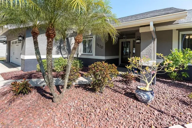 a view of a chairs and table in a backyard