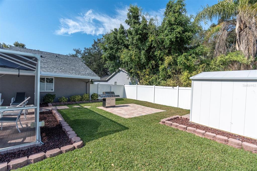 1170 Falcon Ridge Lane Palm Harbor, FL 34683 - Photo 32 of 35 a front view of a house with garden