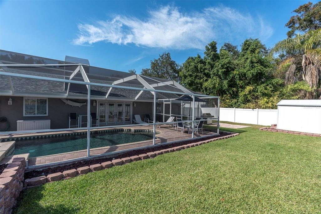 1170 Falcon Ridge Lane Palm Harbor, FL 34683 - Photo 33 of 35 a front view of a house with a yard