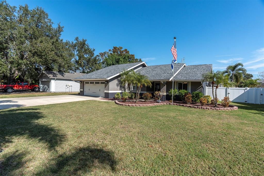 1170 Falcon Ridge Lane Palm Harbor, FL 34683 - Photo 34 of 35 a view of a house with swimming pool and sitting area