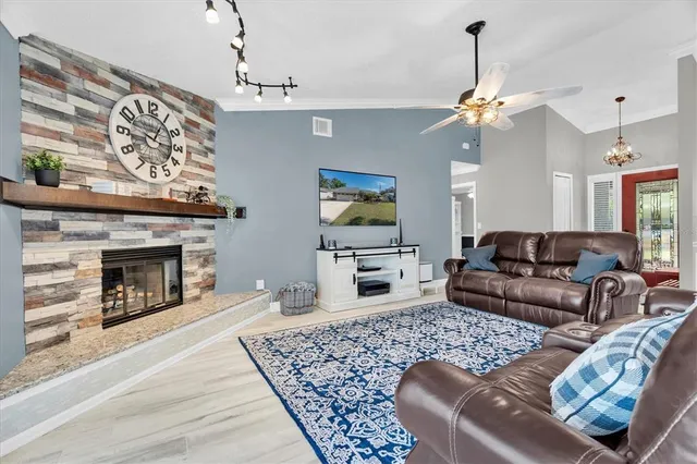 a living room with furniture and a fireplace