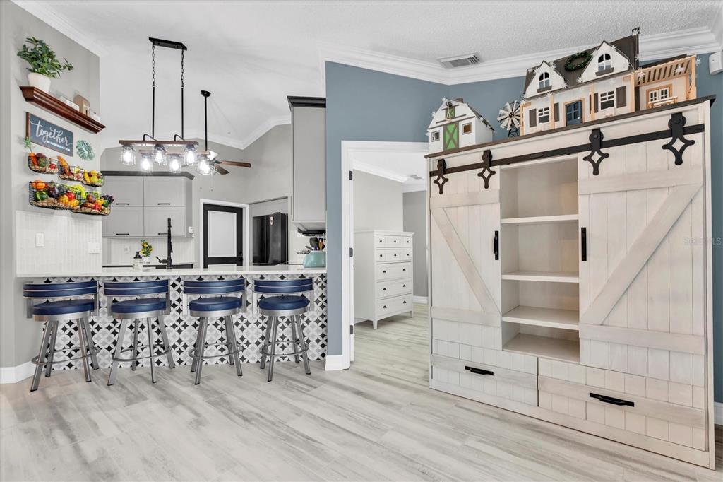 1170 Falcon Ridge Lane Palm Harbor, FL 34683 - Photo 8 of 35 an open kitchen with granite countertop a stove and cabinets