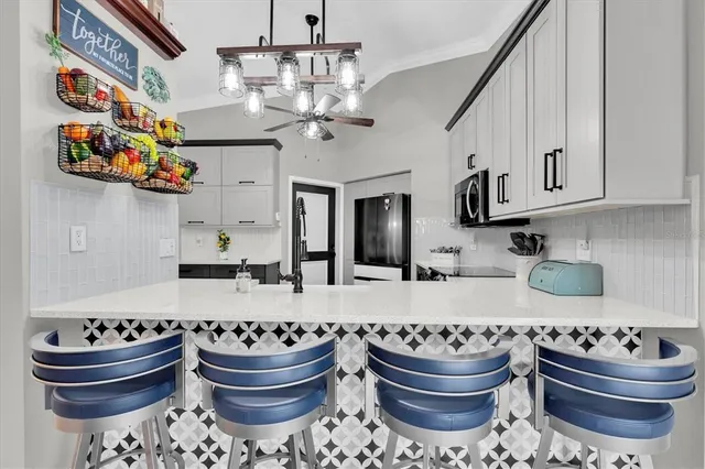 a kitchen with a sink and a stove