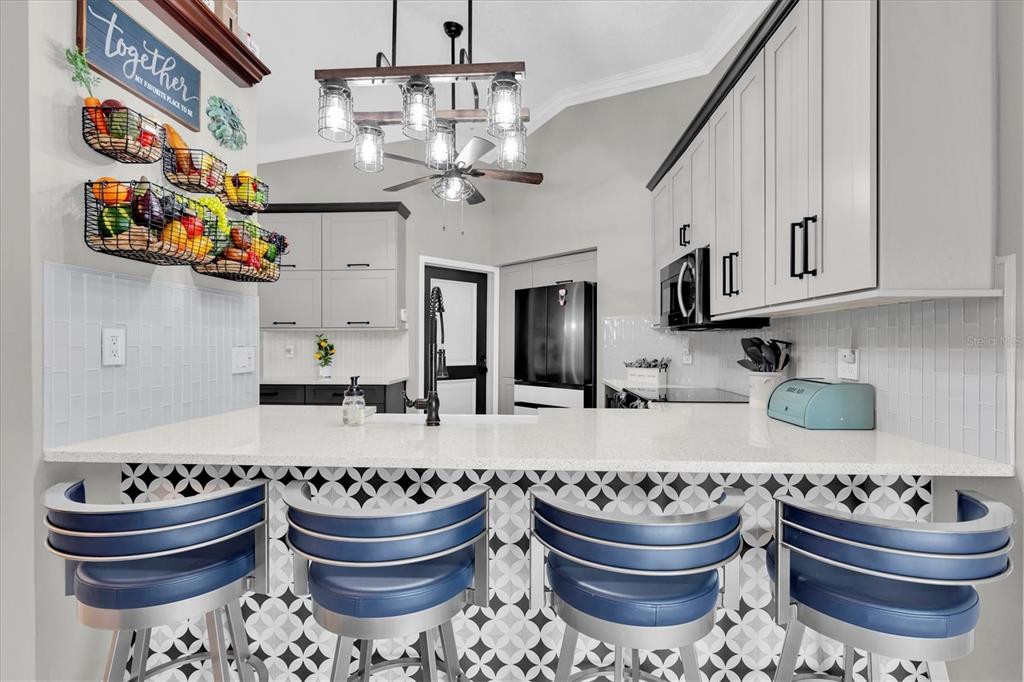 1170 Falcon Ridge Lane Palm Harbor, FL 34683 - Photo 9 of 35 a kitchen with a sink and a stove