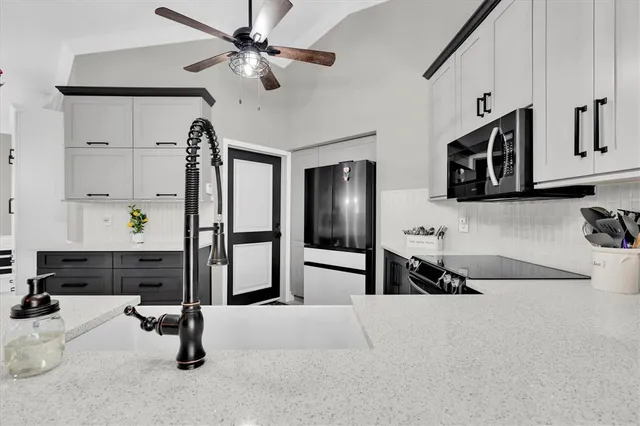 a view of living room with furniture and flat screen tv
