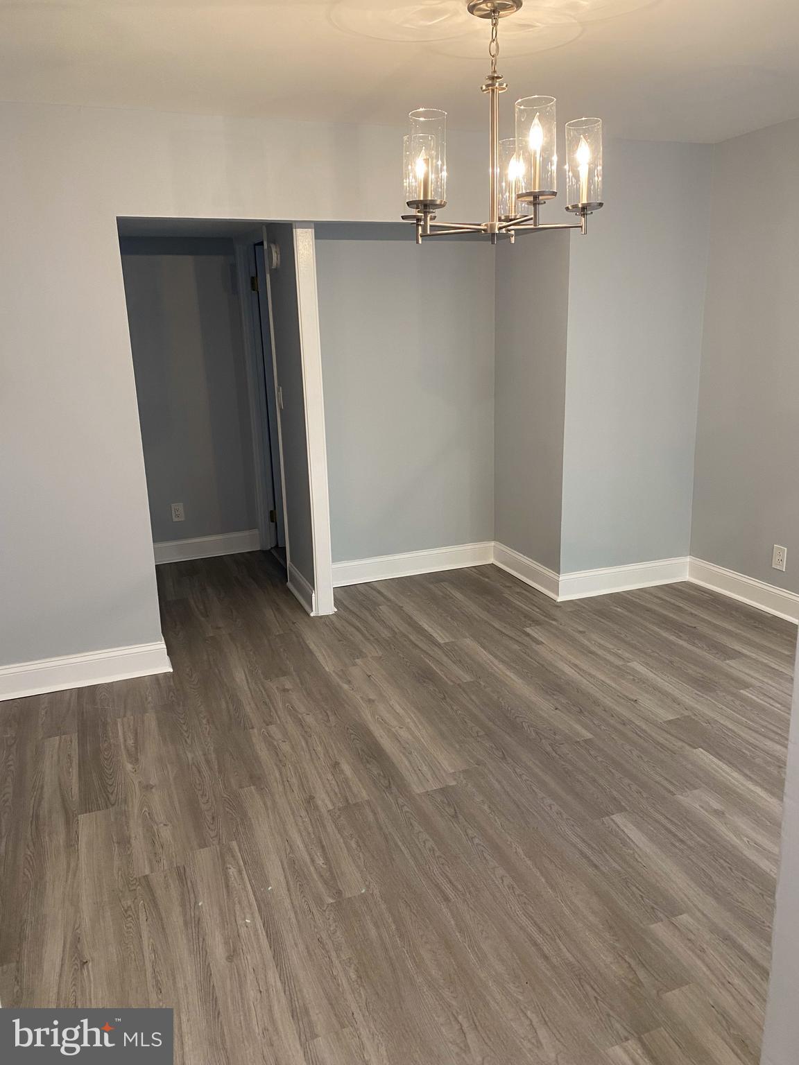7515 Spring Lake Drive, Unit D2 Bethesda, MD 20817 - Photo 3 of 8 wooden floor in an empty room with wooden floor