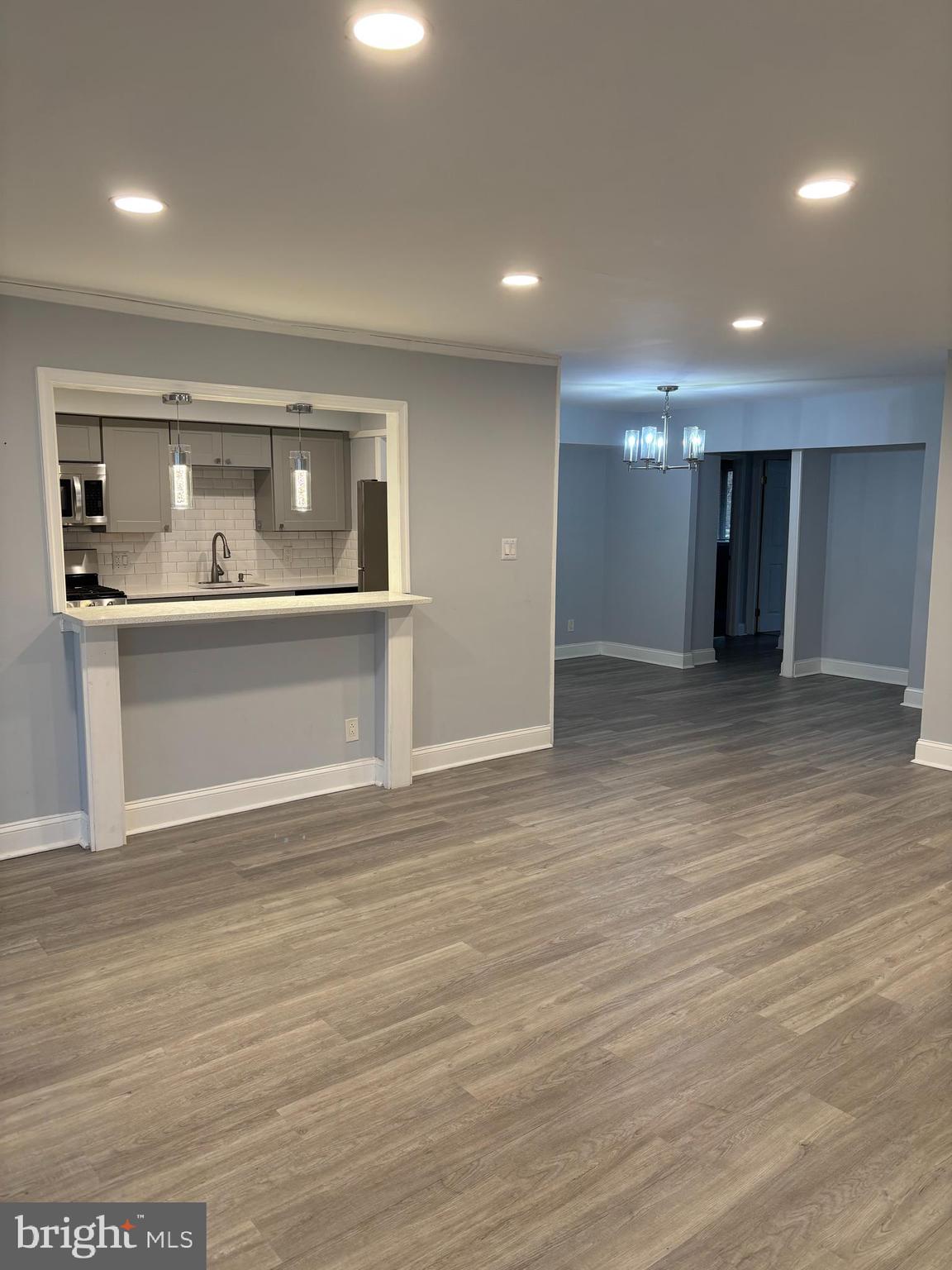 7515 Spring Lake Drive, Unit D2 Bethesda, MD 20817 - Photo 5 of 8 a view of empty room with wooden floor