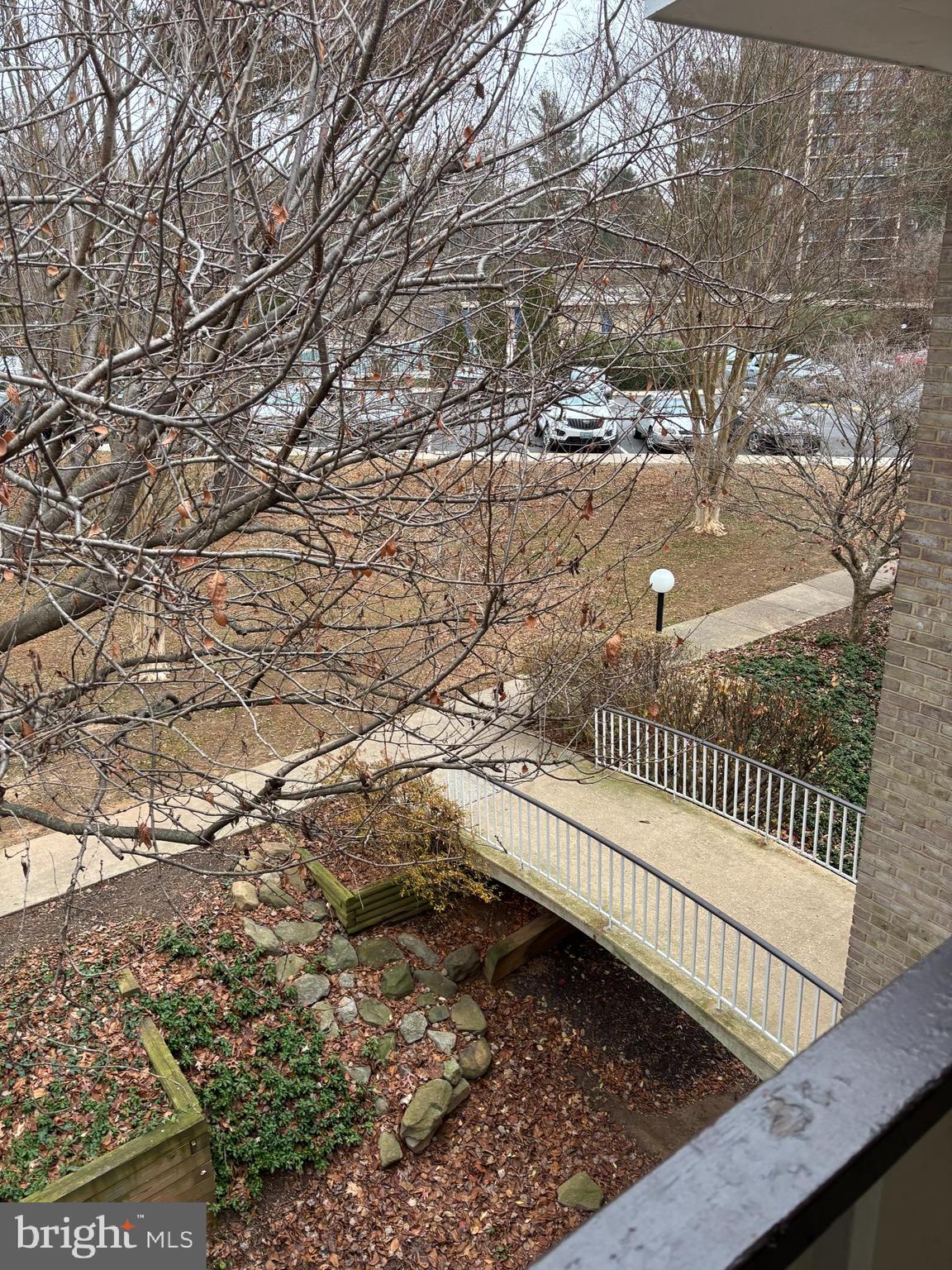 7515 Spring Lake Drive, Unit D2 Bethesda, MD 20817 - Photo 8 of 8 a view of balcony with wooden floor