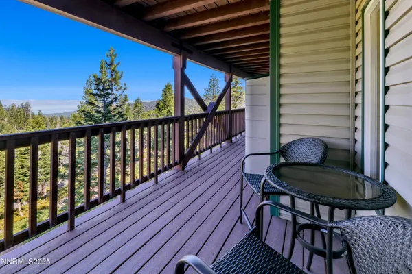 a balcony view with a seating space