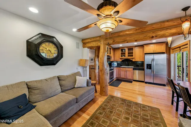 a living room with furniture and kitchen view