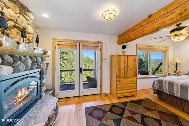 a bedroom with furniture and a fireplace