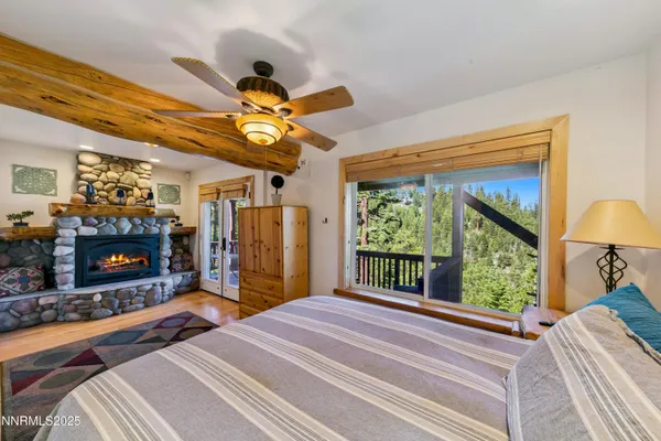 a bedroom with a bed and a fireplace