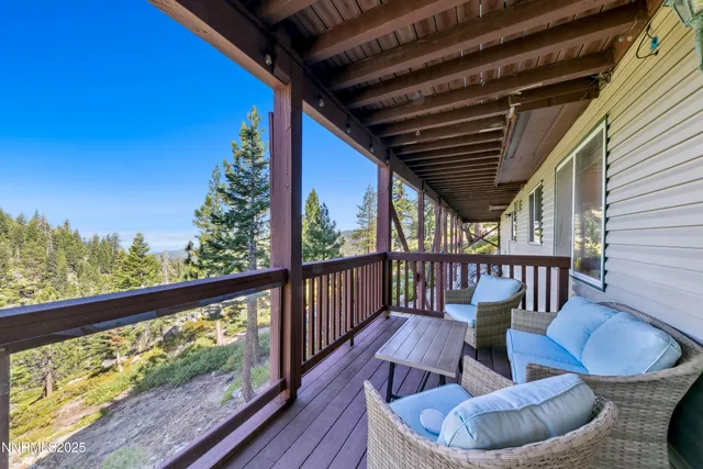 a view of two chairs in the balcony