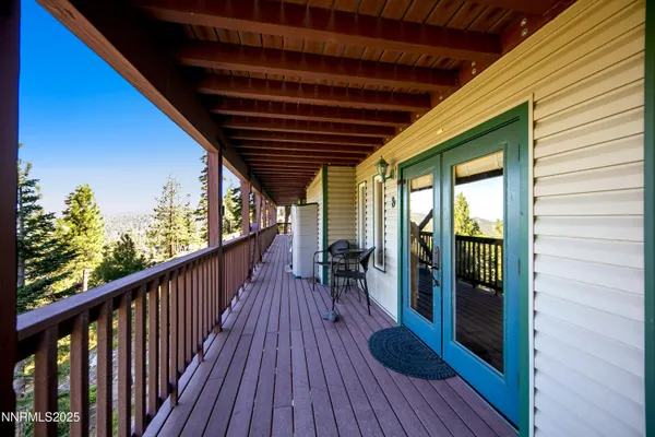a view of balcony with wooden floor