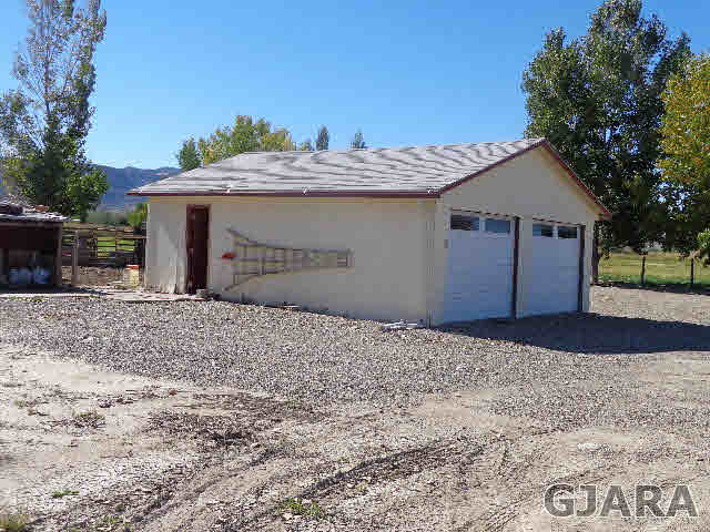 2049 I Road Fruita, CO 81521 - Photo 4 of 30 a view of a house with a yard