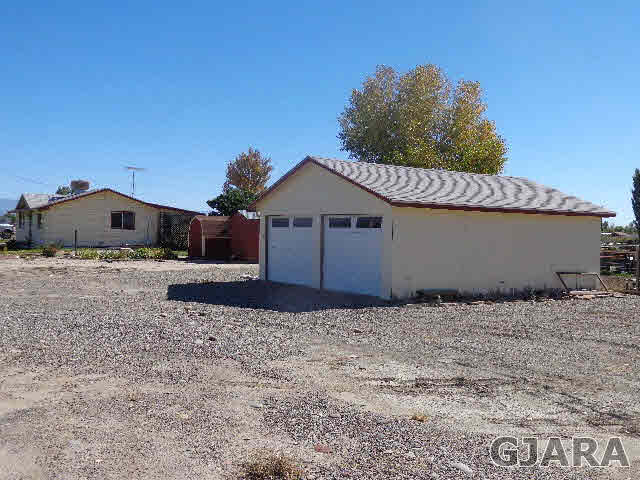 2049 I Road Fruita, CO 81521 - Photo 5 of 30 a house with trees in the background