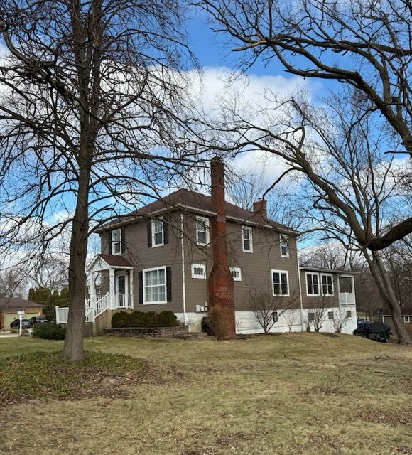 18205 Highland Avenue Homewood, IL 60430 - Photo 1 of 4 a front view of a house with a yard