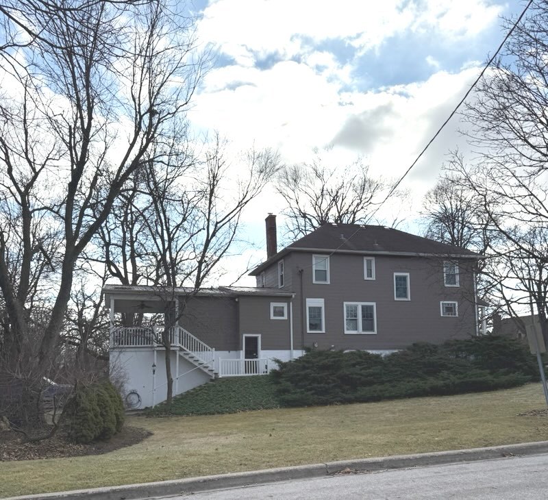 18205 Highland Avenue Homewood, IL 60430 - Photo 4 of 4 a front view of a house with yard and garage