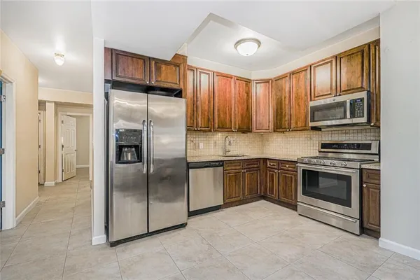 $989,000 | 8403 19th Avenue, Unit 1A | Van Pelt Manor
