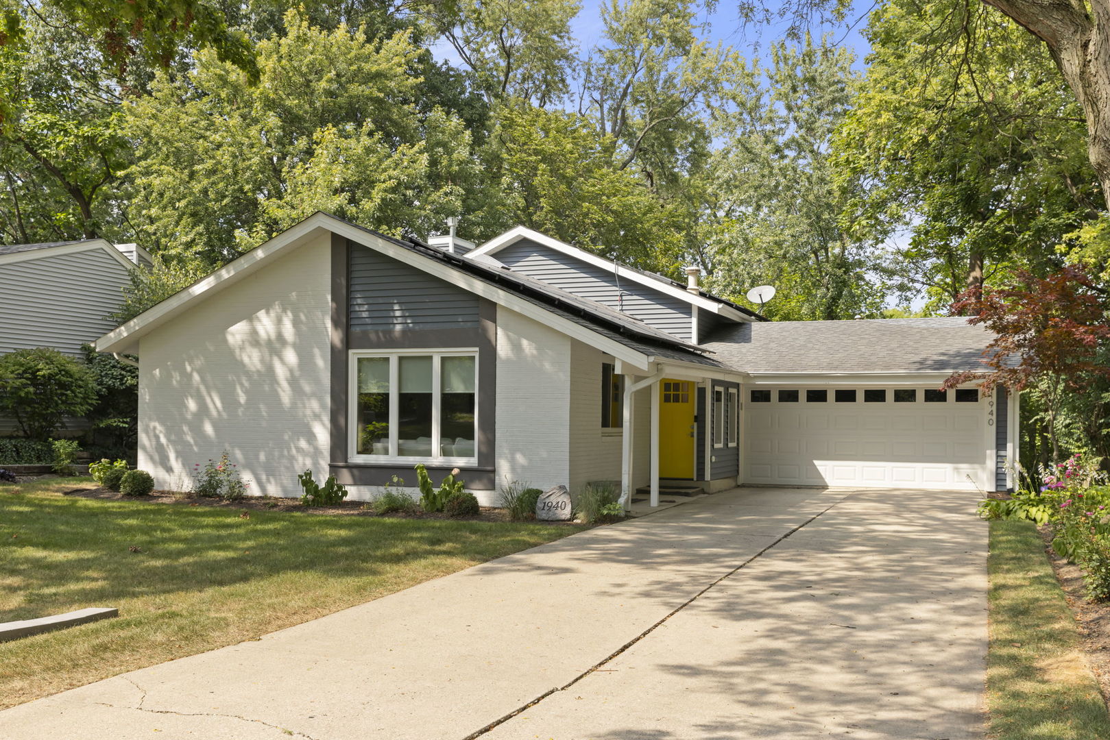 1940 Green Trails Drive Lisle, IL 60532 - Photo 1 of 31 a front view of a house with a garden and yard