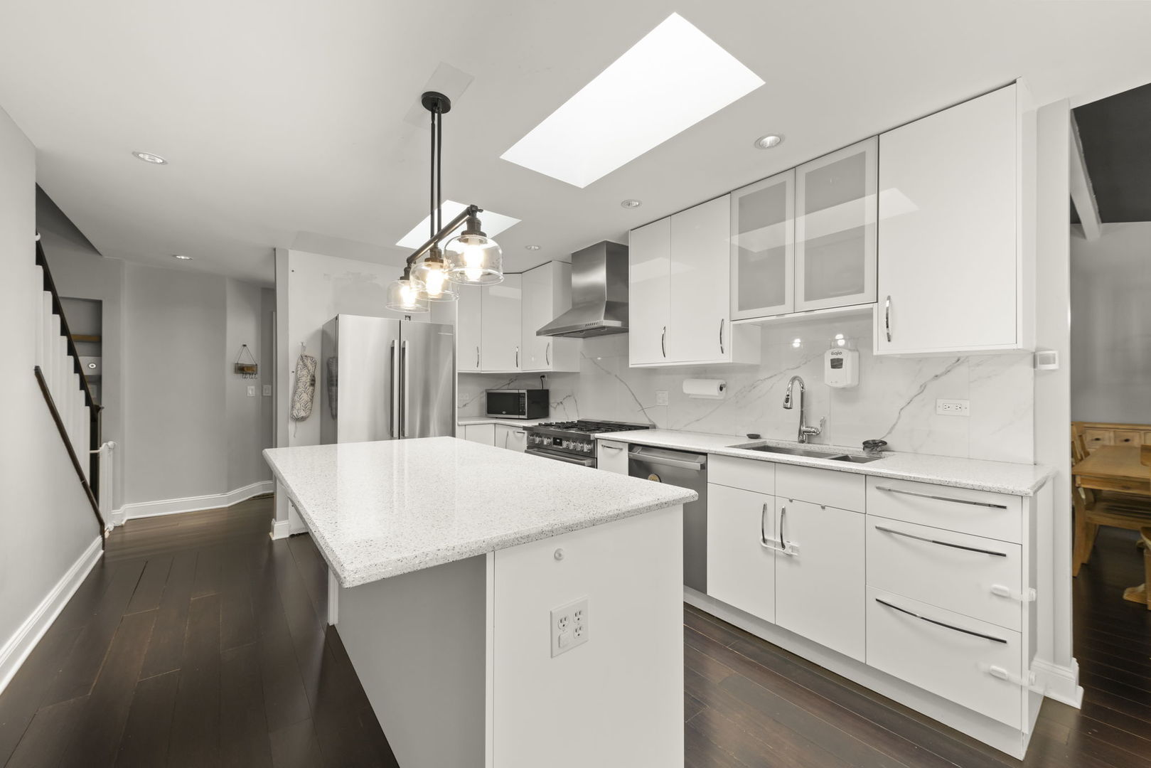 1940 Green Trails Drive Lisle, IL 60532 - Photo 10 of 31 a kitchen with white cabinets a sink dishwasher and a stove with wooden floor