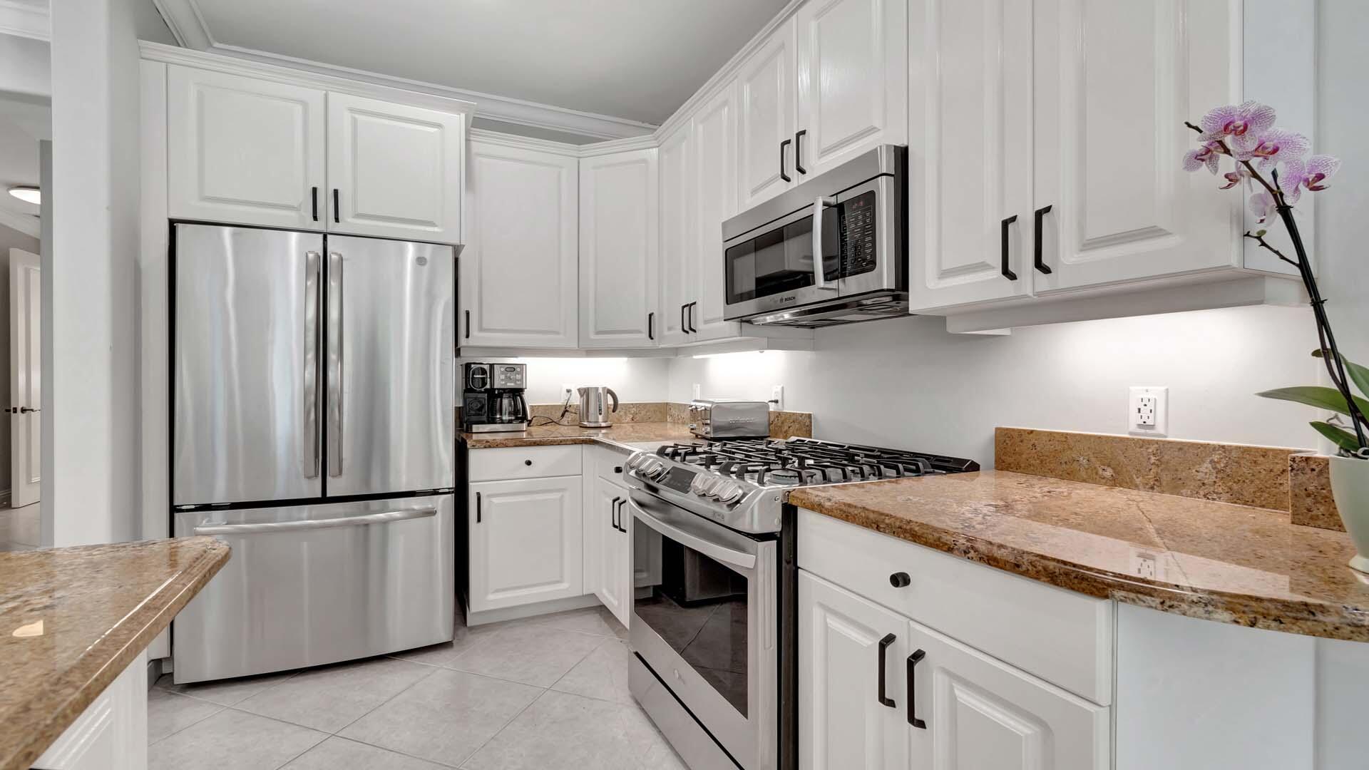 514 Northwest 13th Street Delray Beach, FL 33444 - Photo 15 of 35 a kitchen with granite countertop a stainless steel appliances and cabinets