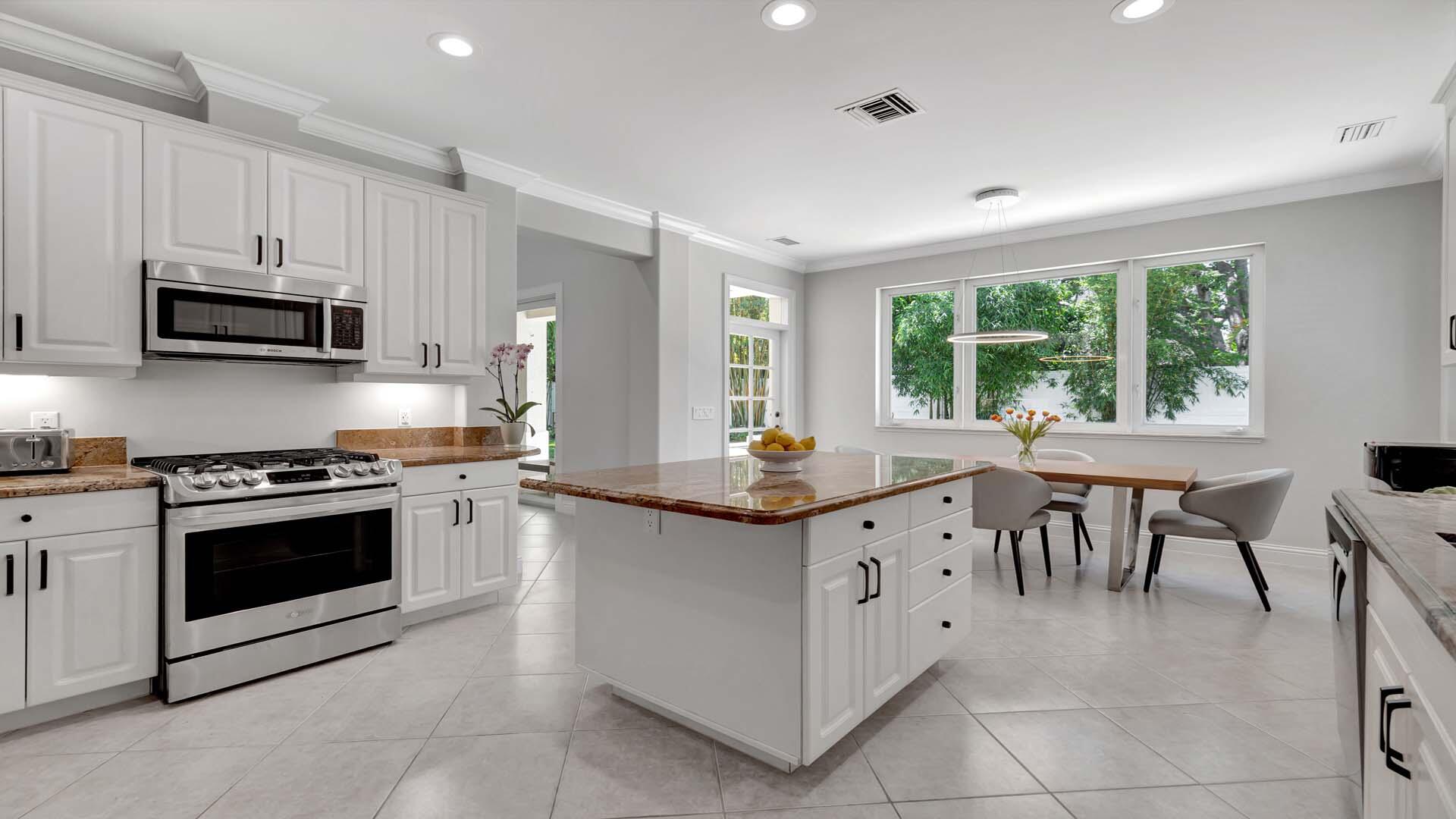 514 Northwest 13th Street Delray Beach, FL 33444 - Photo 16 of 35 a kitchen with granite countertop appliances cabinets and furniture