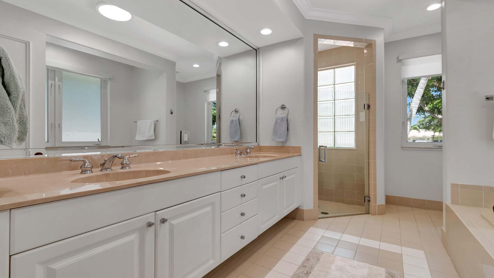 514 Northwest 13th Street Delray Beach, FL 33444 - Photo 19 of 35 a bathroom with double vanity sink and a mirror