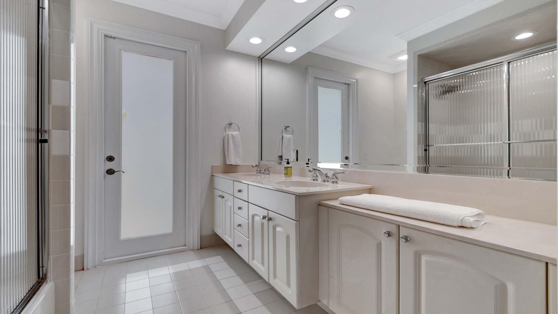514 Northwest 13th Street Delray Beach, FL 33444 - Photo 23 of 35 a bathroom with double sink and two mirror