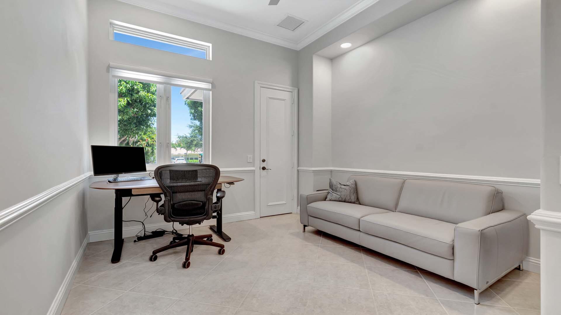 514 Northwest 13th Street Delray Beach, FL 33444 - Photo 27 of 35 a living room with furniture and a flat screen tv