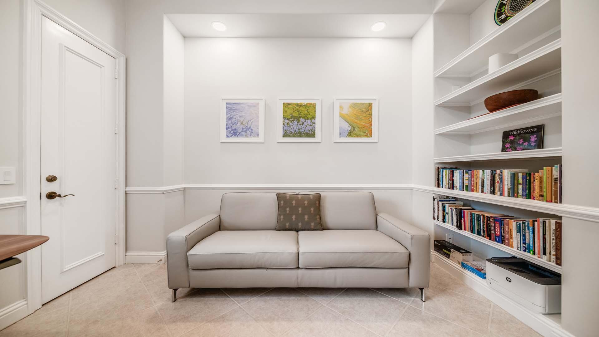 514 Northwest 13th Street Delray Beach, FL 33444 - Photo 29 of 35 a living room with furniture and a book shelf