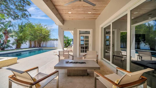 a view of a patio with couches table and chairs