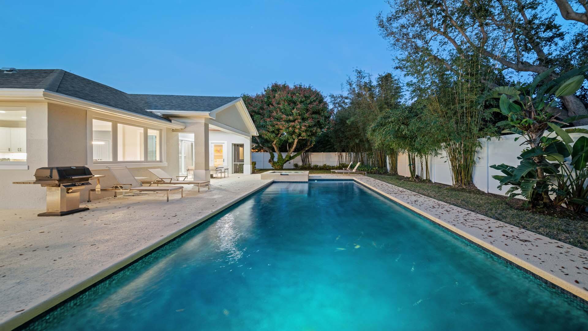 514 Northwest 13th Street Delray Beach, FL 33444 - Photo 4 of 35 a view of a swimming pool with an outdoor seating