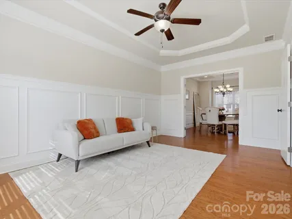 a living room with furniture and a table