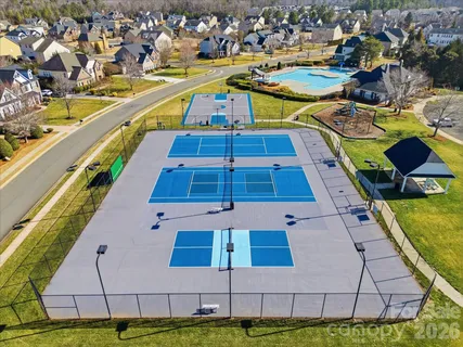 a view of a swimming pool with outdoor seating