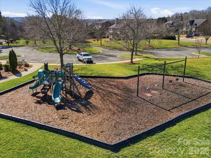 a view of a park with swings
