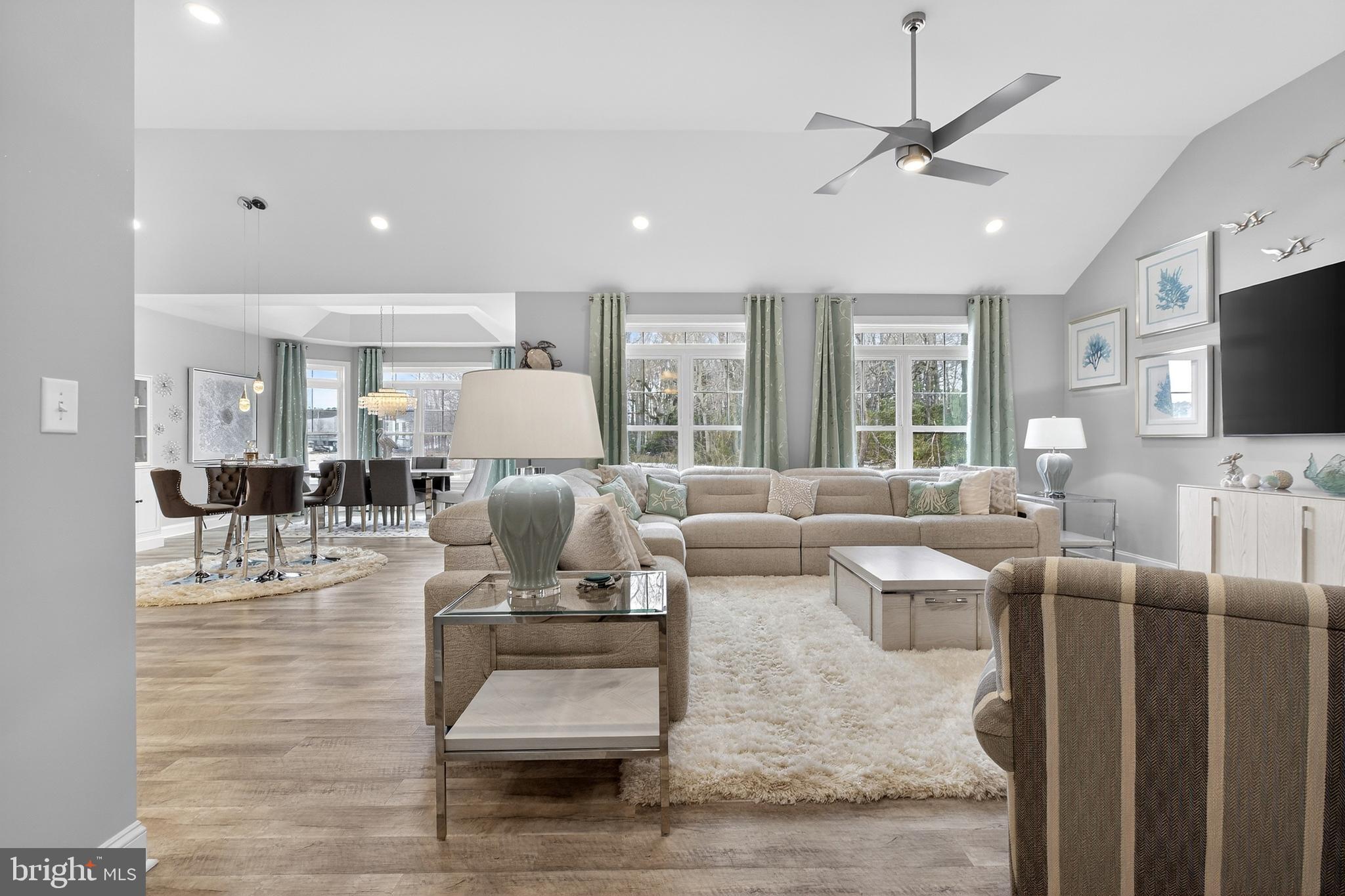 32143 Lynch Road Selbyville, DE 19975 - Photo 14 of 56 a living room with furniture and a flat screen tv