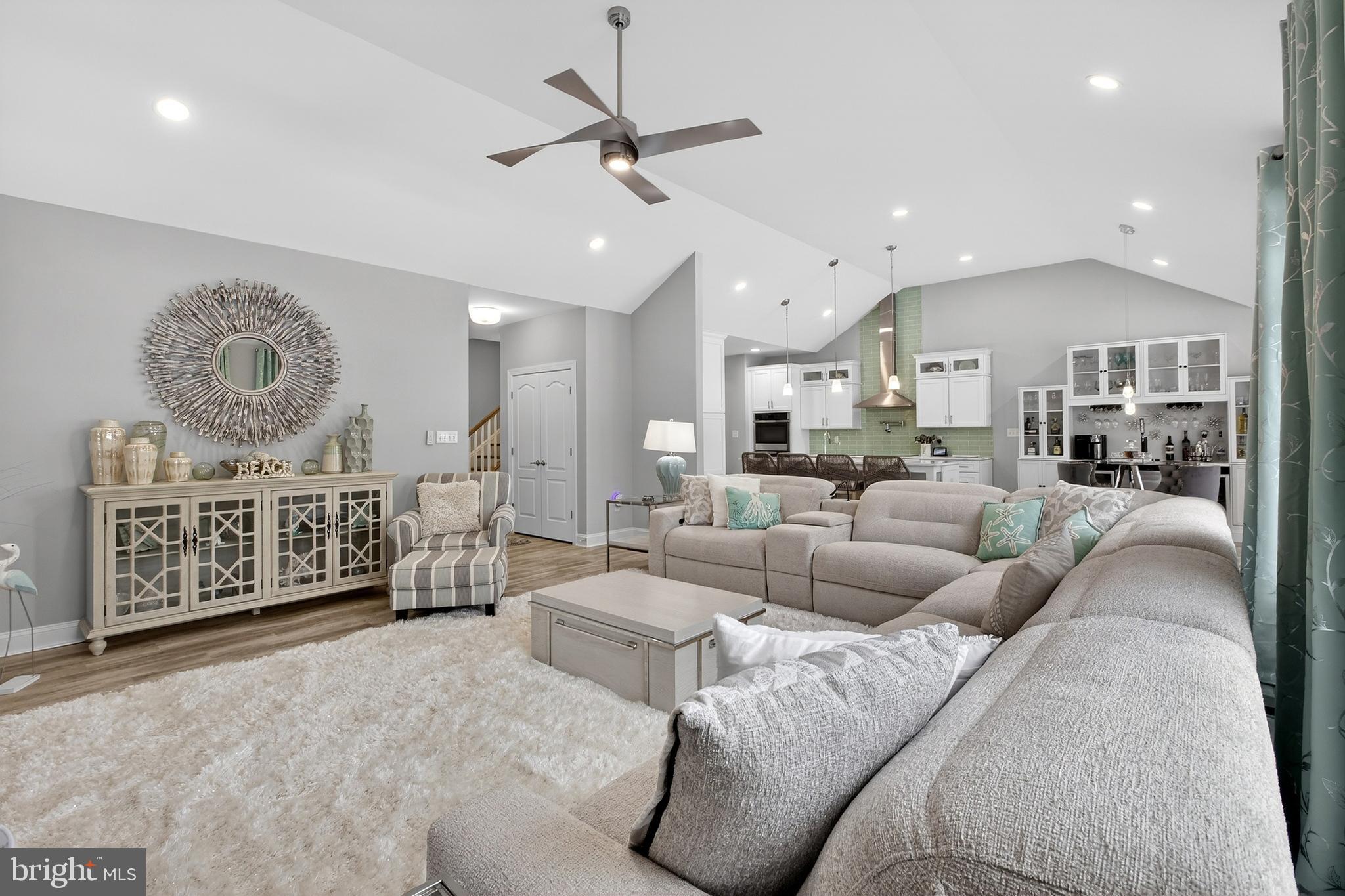 32143 Lynch Road Selbyville, DE 19975 - Photo 17 of 56 a living room with furniture a ceiling fan and a rug
