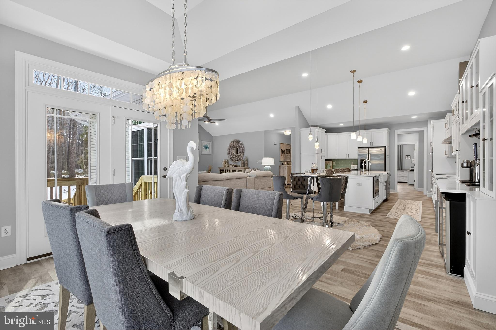 32143 Lynch Road Selbyville, DE 19975 - Photo 20 of 56 a view of a dining room with furniture and wooden floor
