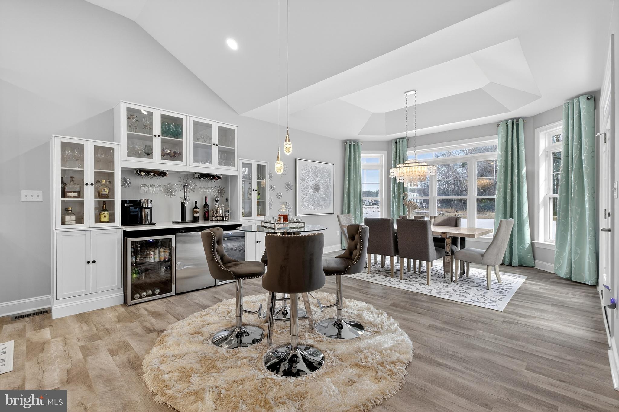 32143 Lynch Road Selbyville, DE 19975 - Photo 22 of 56 a dining room with furniture and wooden floor