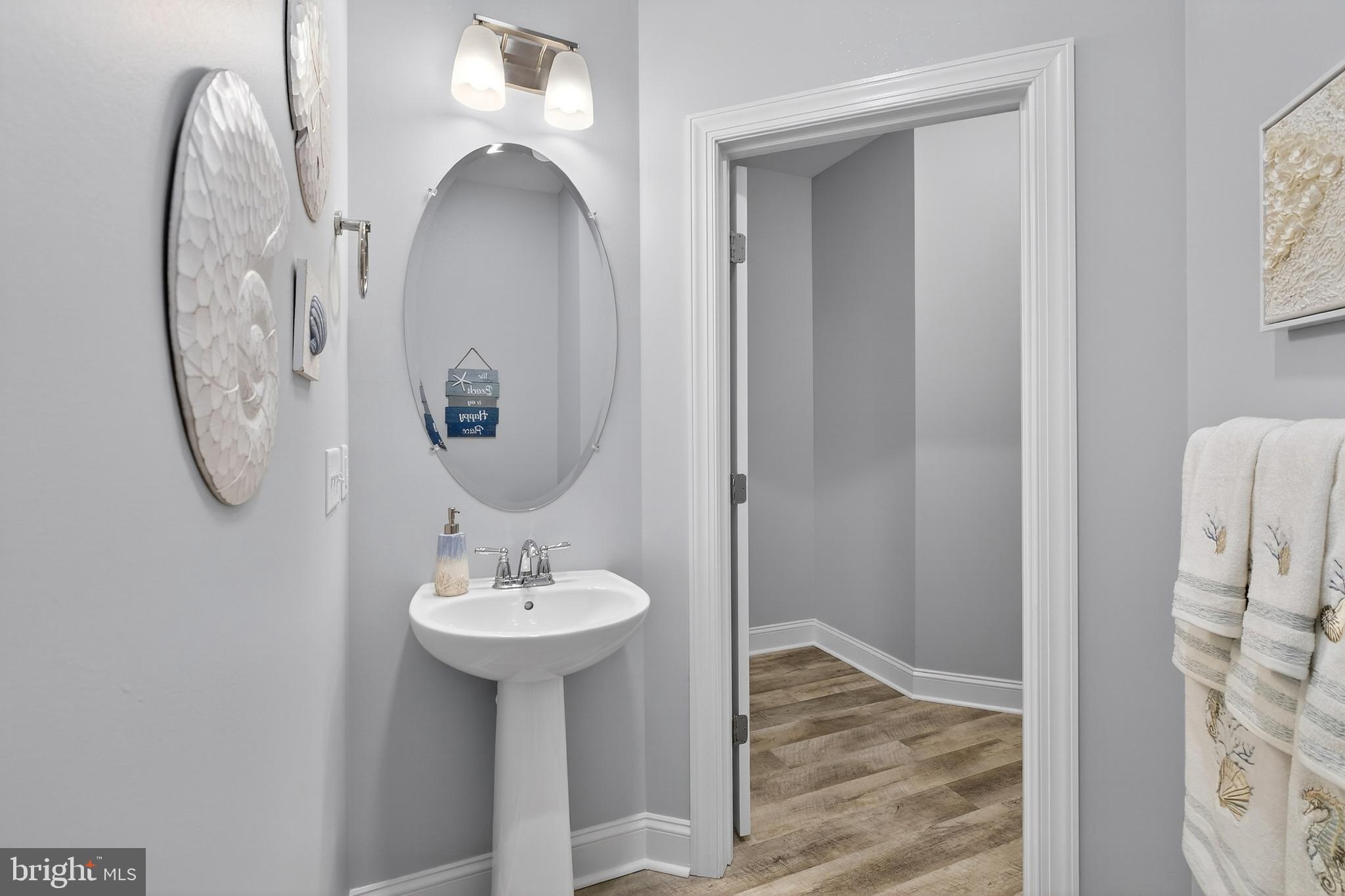 32143 Lynch Road Selbyville, DE 19975 - Photo 29 of 56 a bathroom with a sink and a mirror