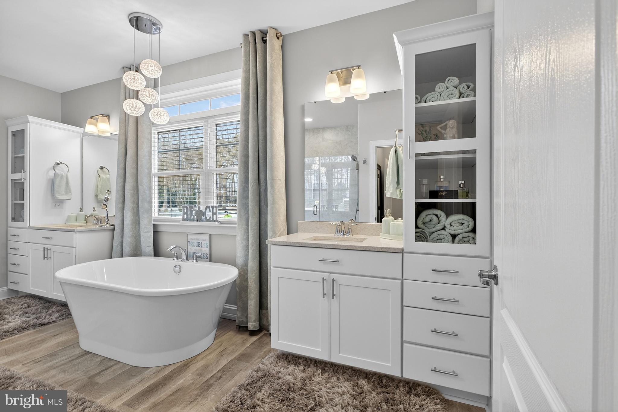 32143 Lynch Road Selbyville, DE 19975 - Photo 32 of 56 a view of a bathroom with a bathtub and sink